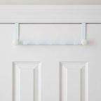 White buttoned edge metal door hanger